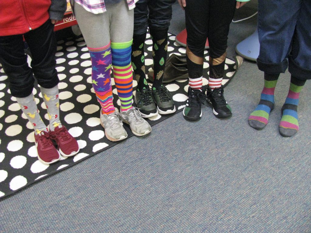 Students displaying their crazy socks. 